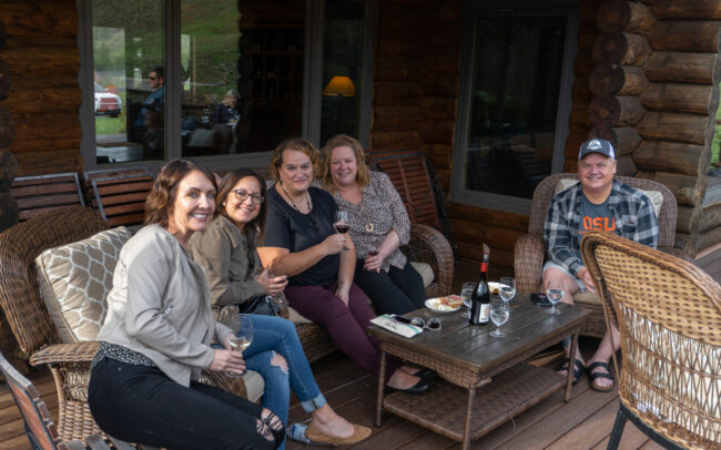 A group of people enjoying a tasting at St. Innocent Winery