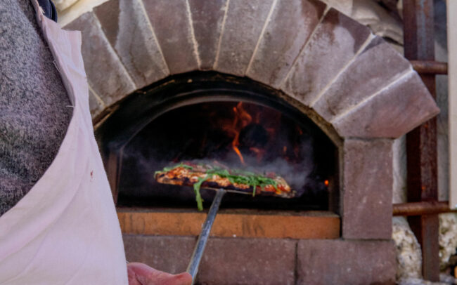 Making wood fired pizza