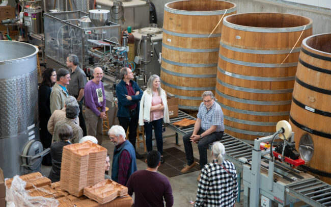 Mark leading a tour of the production facility to wine club members
