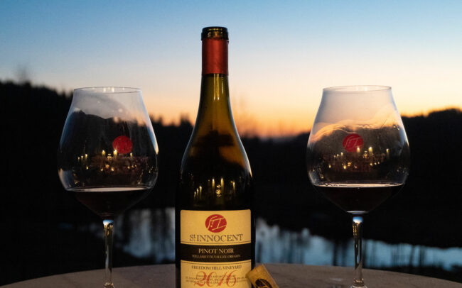 Bottle of St. Innocent 2016 Pinot Noir with two glasses