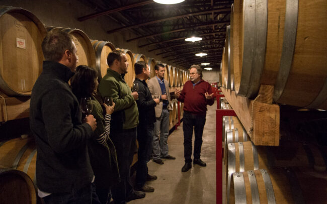 Mark speaking to guests during a private barrel room tour